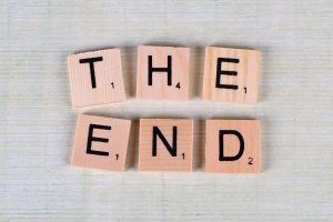 words "THE END" on wooden pieces