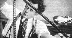 Sergei Eisenstein examining film